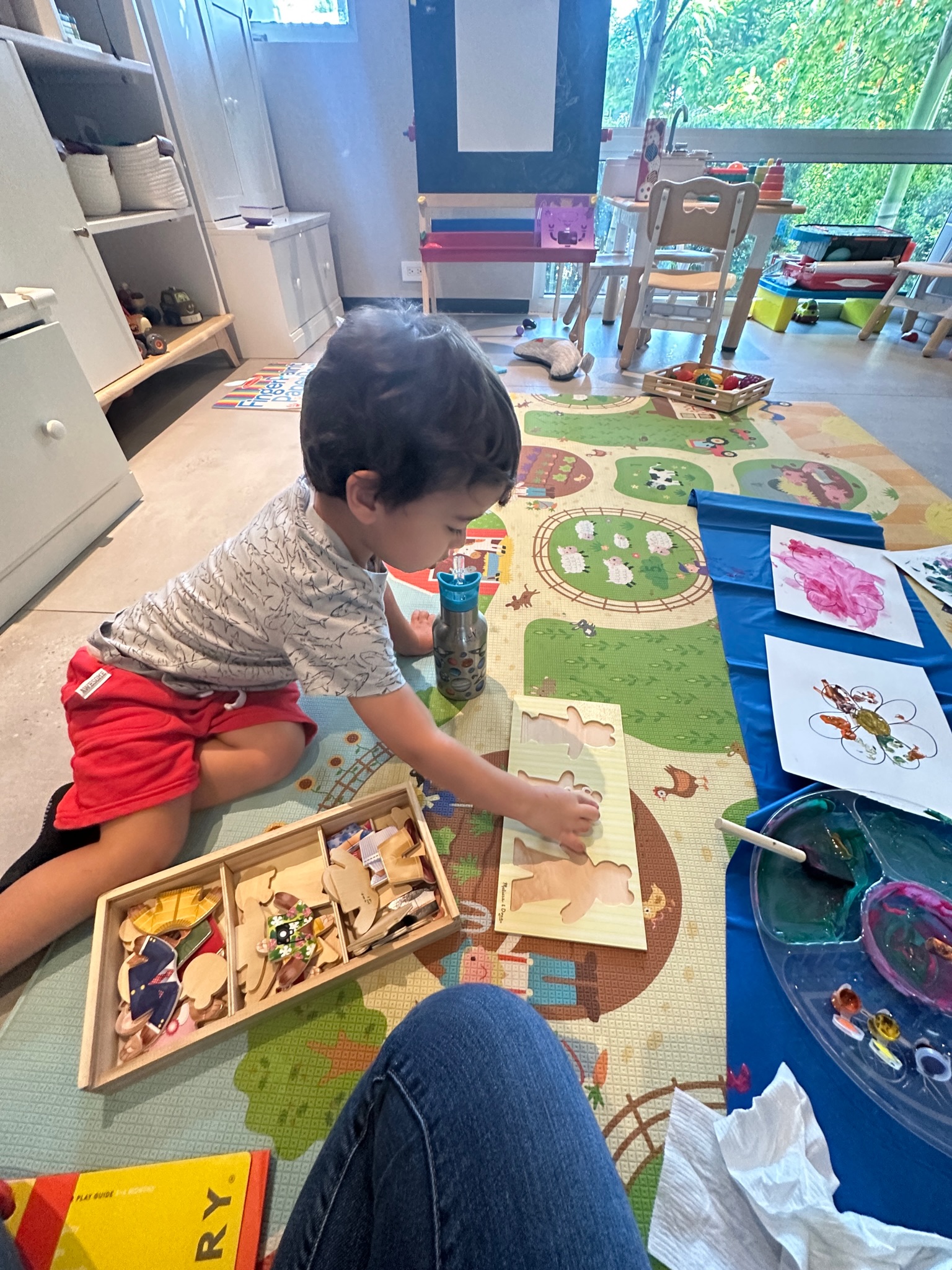 A toddler doing a guided activity at home