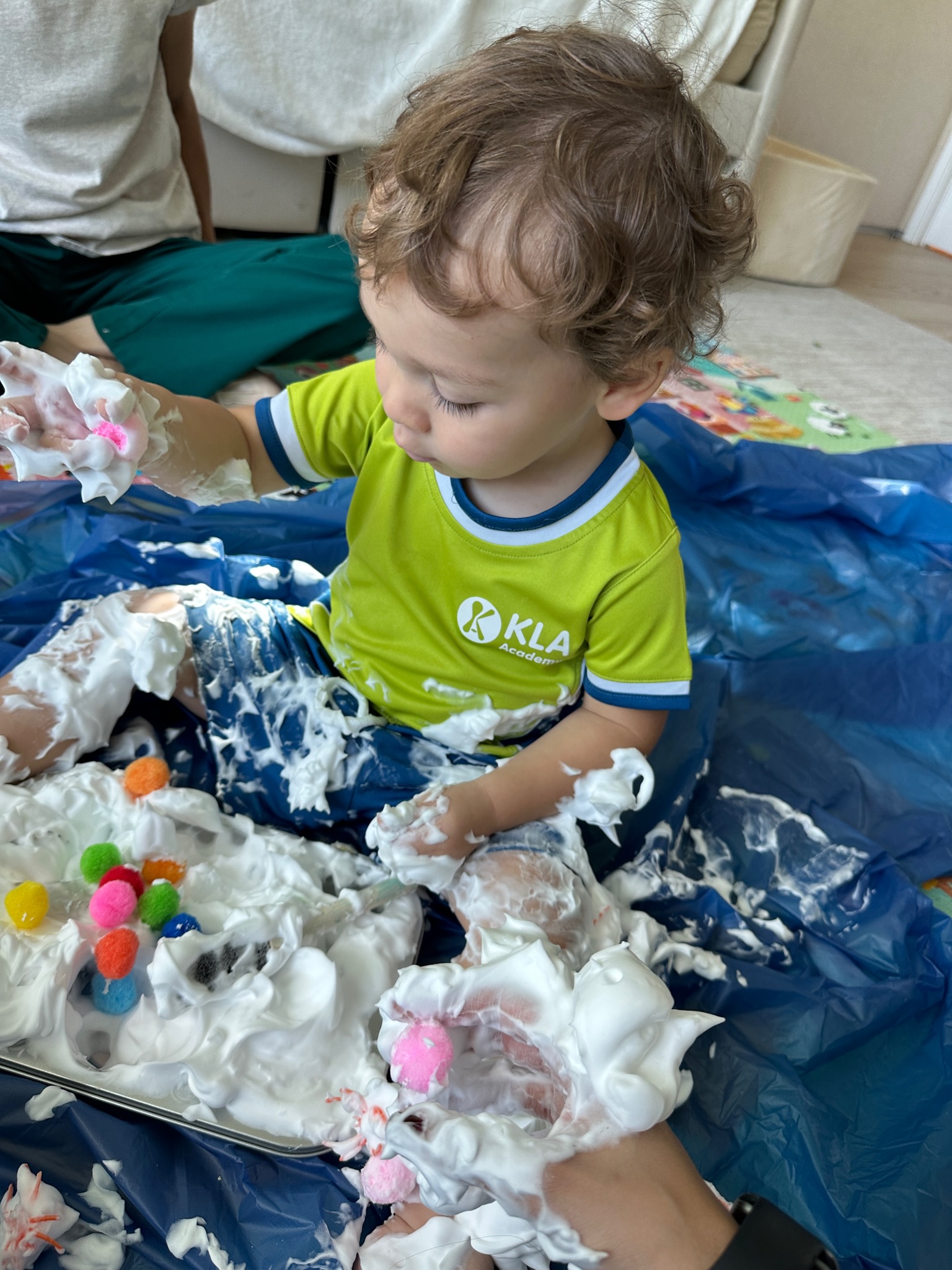 A baby exploring a soft sensory activity